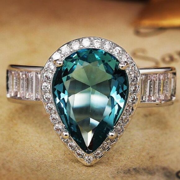 Pear Cut Blue Sapphire Flanked By White Baguette Diamonds on 925 Sterling Silver - Picture 7 of 8